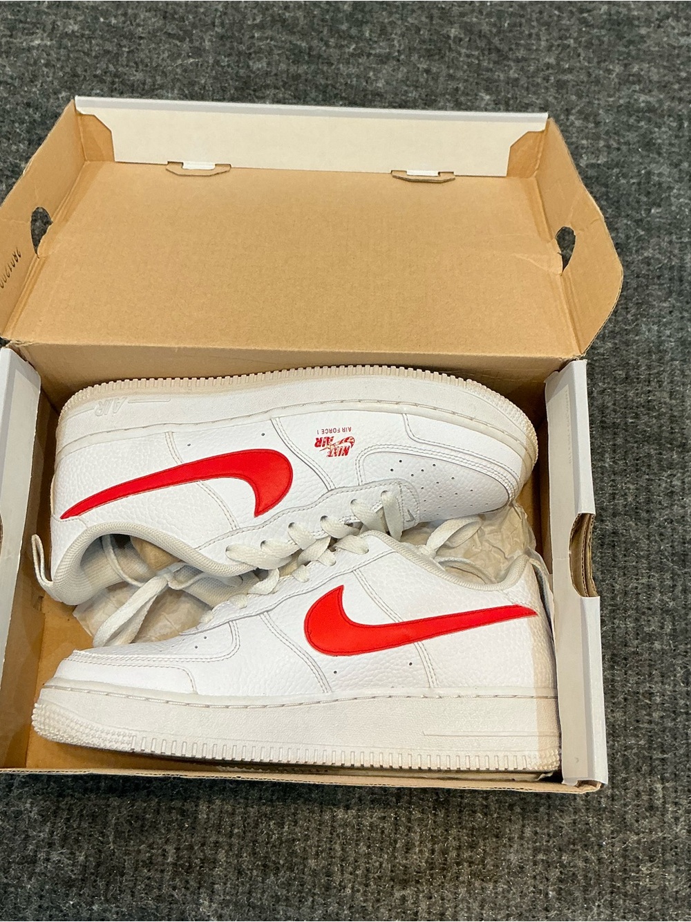 Nike Kids White Sneakers with Bright Red Swoosh